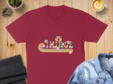 Load image into Gallery viewer, Maroon t-shirt with colorful floral "NURSE" text and retro rainbow design.
