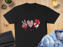Load image into Gallery viewer, Black t-shirt with peace signs, heart, and syringe graphic.
