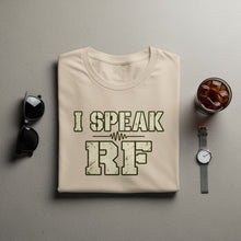 Load image into Gallery viewer, Beige t-shirt with "I SPEAK RF" text and graphic, sunglasses, and drink.
