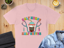 Load image into Gallery viewer, Pink t-shirt with "Half Nurse Half Coffee" text and medical illustrations.
