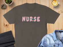 Load image into Gallery viewer, Brown t-shirt with "Nurse coffee, scrubs, rubber gloves" text.
