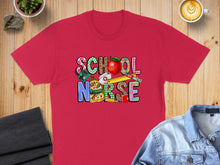 Load image into Gallery viewer, Red t-shirt with "School Nurse" text surrounded by school supplies.
