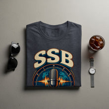 Load image into Gallery viewer, Dark grey t-shirt with "SSB" text and vintage microphone graphic.
