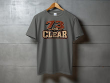 Load image into Gallery viewer, Grey t-shirt with "73 AND CLEAR" vintage-style graphic and microphone.
