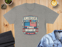 Load image into Gallery viewer, Grey t-shirt with "America: Land of the Free Because of the Brave 1776" text.
