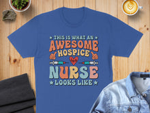 Load image into Gallery viewer, Awesome Hospice Nurse graphic t-shirt with colorful text and medical symbols.
