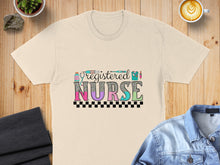 Load image into Gallery viewer, Registered Nurse text with medical icons on a cream t-shirt.
