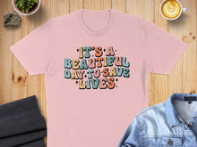 Load image into Gallery viewer, Pink t-shirt with "It's a beautiful day to save lives" text.
