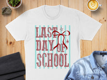 Load image into Gallery viewer, White t-shirt with "Last Day of School" text and red bow.
