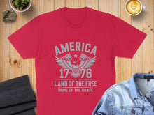 Load image into Gallery viewer, Red t-shirt with "America 1776 Land of the Free Home of the Brave" eagle design.
