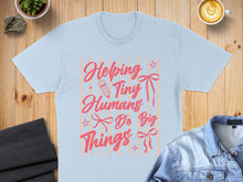Load image into Gallery viewer, Light blue t-shirt with pink text "Helping Tiny Humans Do Big Things".
