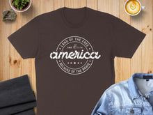 Load image into Gallery viewer, Brown t-shirt with "America" text, stars, and "Land of the Free" inscription.
