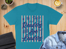 Load image into Gallery viewer, Turquoise t-shirt with "Readers Are Leaders" text and decorative bows.

