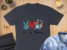 Load image into Gallery viewer, Dark t-shirt with "Peace love Pharmacy" design featuring a heart, pills, and peace sign.
