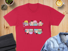 Load image into Gallery viewer, Red t-shirt with cartoon pencils and flowers across the chest.
