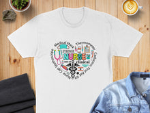 Load image into Gallery viewer, White t-shirt with colorful medical-themed text and icons, including "Nurse" and a stethoscope.
