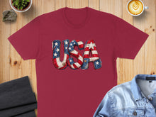 Load image into Gallery viewer, Maroon t-shirt with "USA" in patriotic distressed fabric letters.
