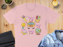 Load image into Gallery viewer, Pink t-shirt with back-to-school illustrations: bus, globe, books, crayons, lightbulb.
