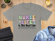 Load image into Gallery viewer, Grey t-shirt with "Nurse Life Is The Best Life" text and floral accents.
