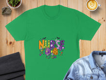 Load image into Gallery viewer, Green t-shirt with "Nurse" in colorful Halloween-themed block letters.
