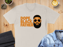 Load image into Gallery viewer, Cream t-shirt with "DOPE. BLACK. FATHER." text and graphic of a man's face.
