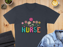 Load image into Gallery viewer, Dark t-shirt with colorful floral "NURSE" text graphic.
