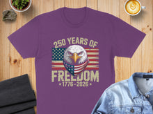 Load image into Gallery viewer, Purple t-shirt with eagle, American flag bandana, and "250 Years of Freedom 1776-2026".
