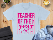 Load image into Gallery viewer, Light blue t-shirt with "TEACHER OF THE YEAR" text and pink stripes.
