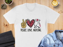 Load image into Gallery viewer, White t-shirt with peace sign heart, stethoscope, and text "Peace. Love. Nursing."
