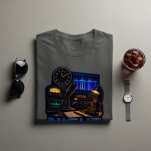 Load image into Gallery viewer, Gray t-shirt with an illustration of a ham radio setup, clock, and coffee.

