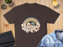 Load image into Gallery viewer, Brown t-shirt with "Nurse" text in pastel rainbow colors and medical icons.
