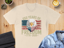 Load image into Gallery viewer, Cream t-shirt with eagle, American flag bandana, and "250 Years of Freedom 1776-2026".
