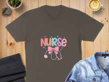Load image into Gallery viewer, Nurse text with stethoscope and floral accents on a brown t-shirt.
