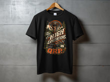 Load image into Gallery viewer, Black t-shirt with "Low Power. High Expectations. QRP." radio graphic.
