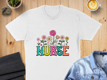 Load image into Gallery viewer, White t-shirt with colorful "Nurse" text and floral graphic.
