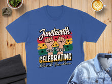 Load image into Gallery viewer, Blue t-shirt with Juneteenth graphic: "Celebrating Black Freedom" and linked hands.
