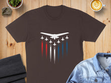 Load image into Gallery viewer, Brown t-shirt with white jets and red, white, and blue contrails.
