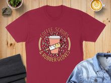 Load image into Gallery viewer, Maroon t-shirt with "COFFEE, SCRUBS &amp; RUBBER GLOVES" in a circular design.
