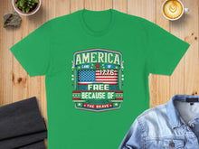 Load image into Gallery viewer, Green t-shirt with "AMERICA LAND OF THE FREE BECAUSE OF THE BRAVE 1776" text.
