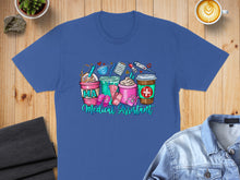 Load image into Gallery viewer, Blue t-shirt with cartoon medical supplies and coffee cups.
