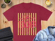 Load image into Gallery viewer, Burgundy t-shirt with "TEACHER" in pink letters and a lightning bolt accent.

