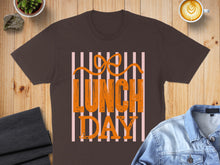 Load image into Gallery viewer, Brown t-shirt with "Lunch Day" text and striped design.
