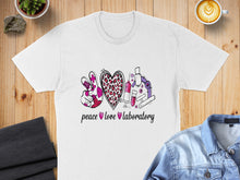 Load image into Gallery viewer, White t-shirt with "peace love laboratory" graphic featuring a peace sign, heart, and lab equipment.
