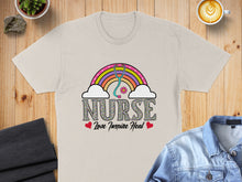 Load image into Gallery viewer, T-shirt with rainbow stethoscope and "Nurse Love Inspire Heal" text.

