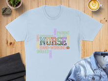 Load image into Gallery viewer, Light blue t-shirt with colorful "NURSE" word cloud and related terms.
