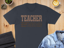 Load image into Gallery viewer, Dark t-shirt with "TEACHER SOME DAYS I ROCK IT SOME DAYS IT ROCKS ME EITHER WAY WE ROCKIN' IT" text.
