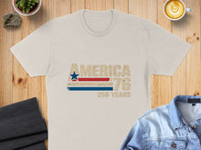 Load image into Gallery viewer, Cream t-shirt with "AMERICA '76" and red, white, blue stripe.
