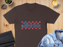Load image into Gallery viewer, Brown t-shirt with "America" in a red and blue checkerboard pattern.
