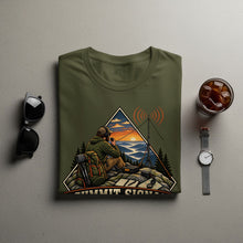 Load image into Gallery viewer, Olive green t-shirt with "Summit Signal" graphic of a hiker with radio on mountain at sunset.
