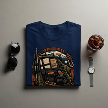 Load image into Gallery viewer, Navy t-shirt with graphic of backpack, radio, logbook, and mountains.
